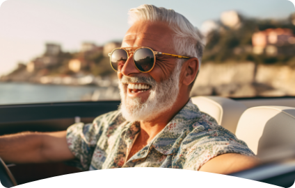 Old man smiling while driving